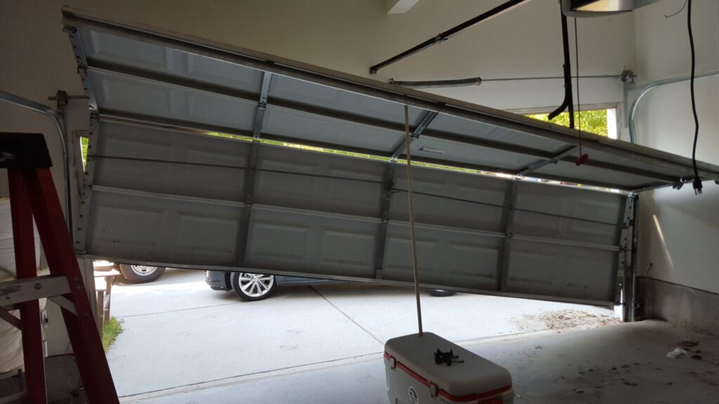 image of a broken garage door to represent garage door repair